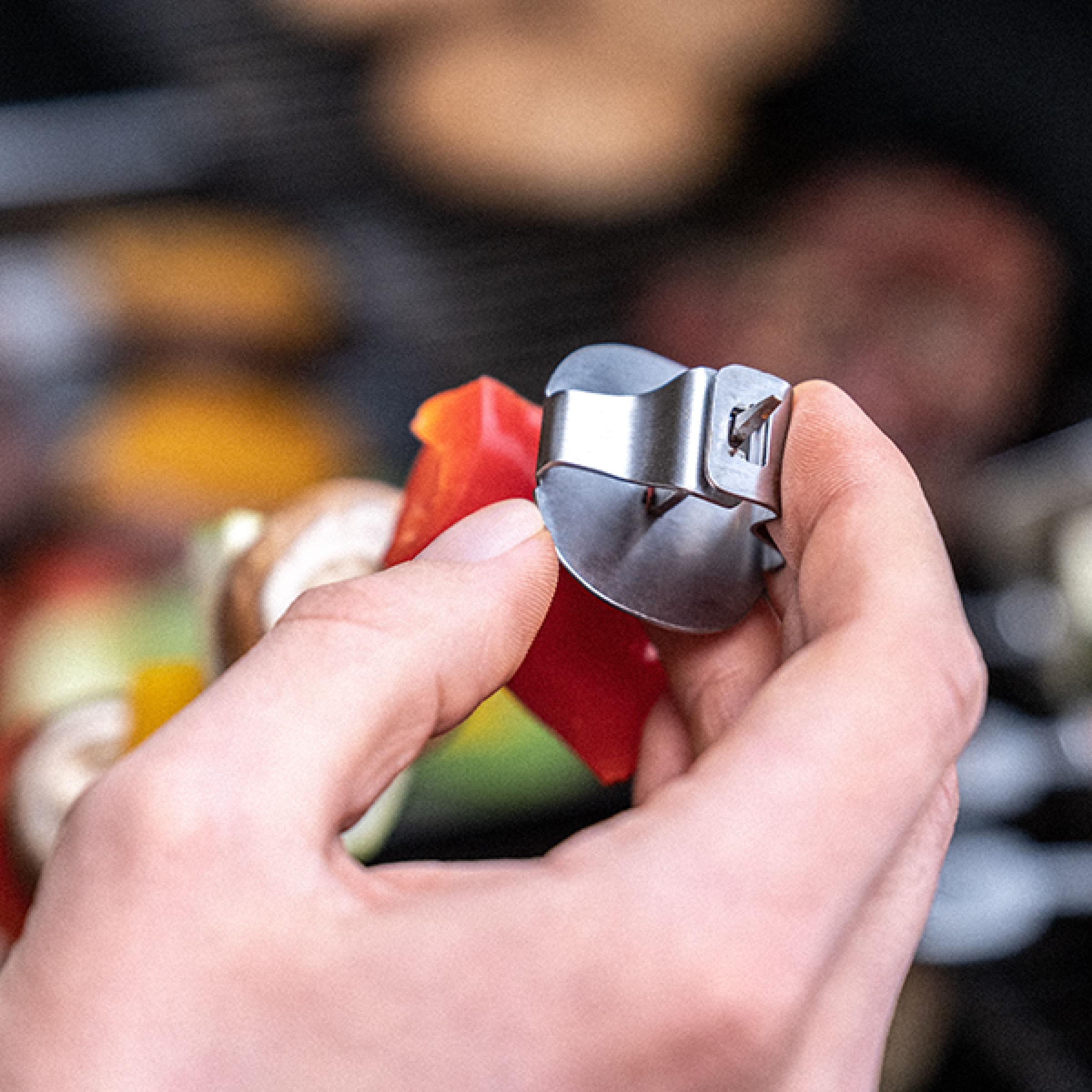 Stainless steel skewer with metal clip, pointed end and loop handle