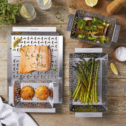 Stainless grill baskets with perforated pattern, used for vegetables and meat