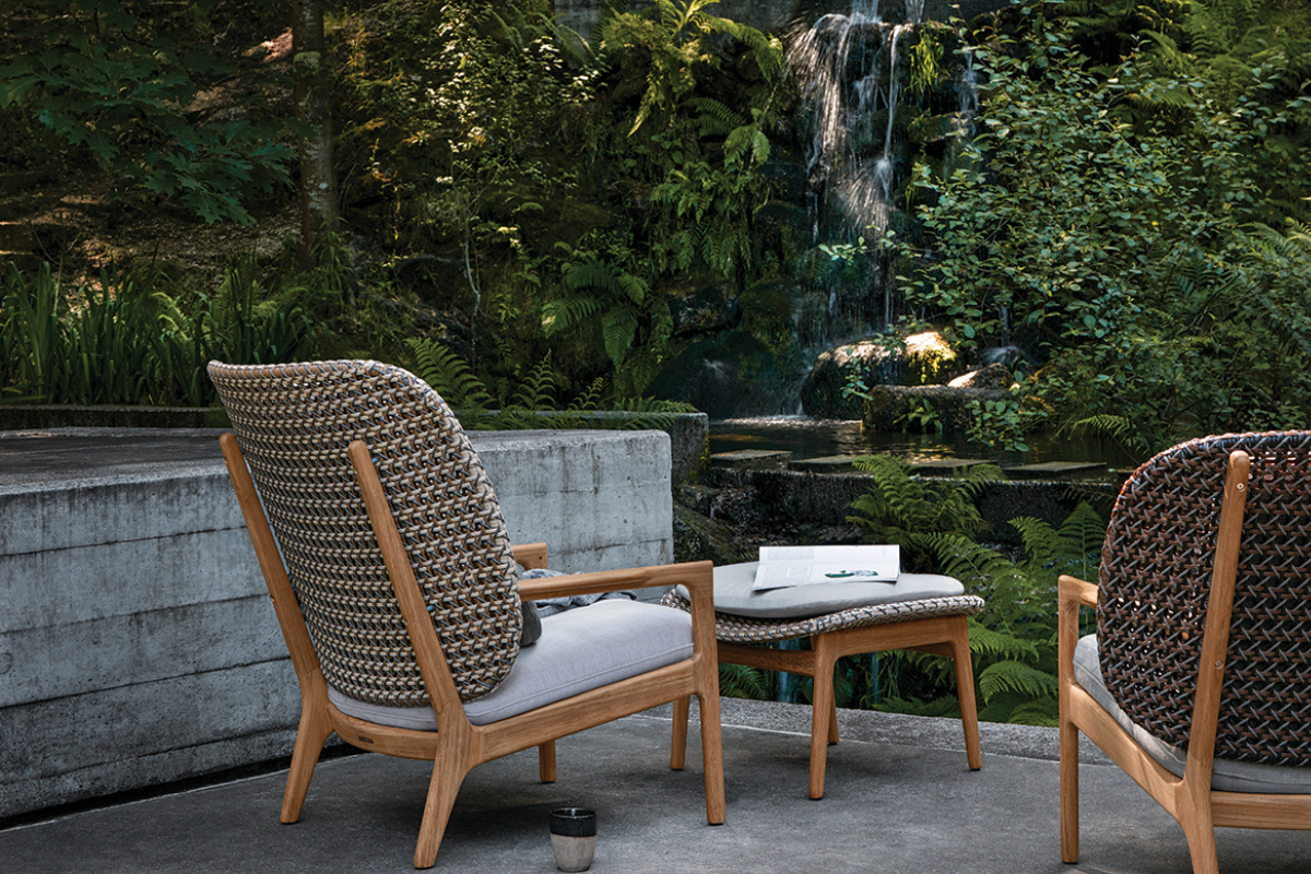 Gloster Kay lounge chairs and ottoman in a luxury outdoor living space